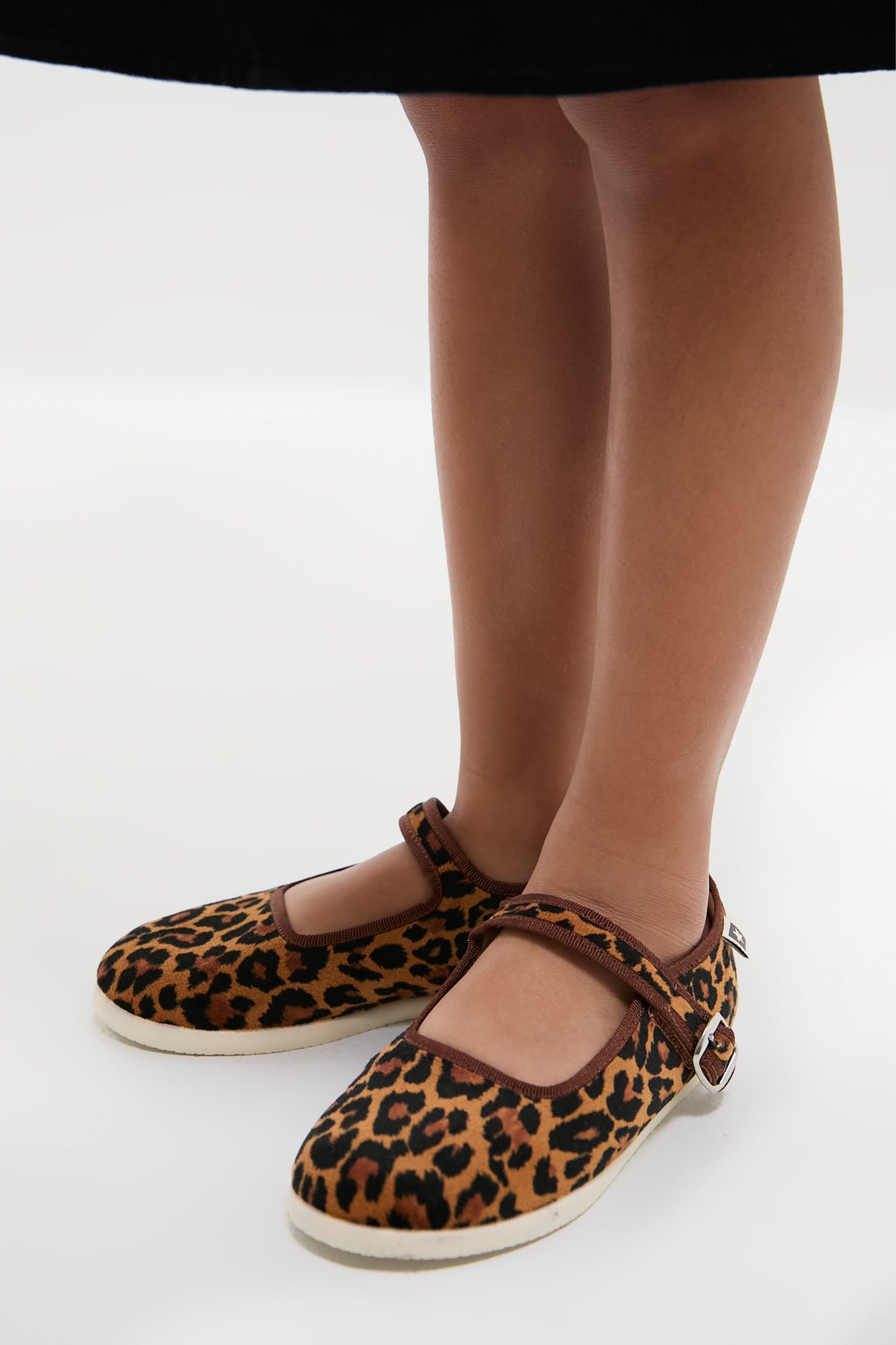 Leopard Mary Jane Flats: Classic and fun, these high-end shoes feature an effortless leopard print, adjustable velcro strap, and durable rubber sole, perfect for adventurous children.