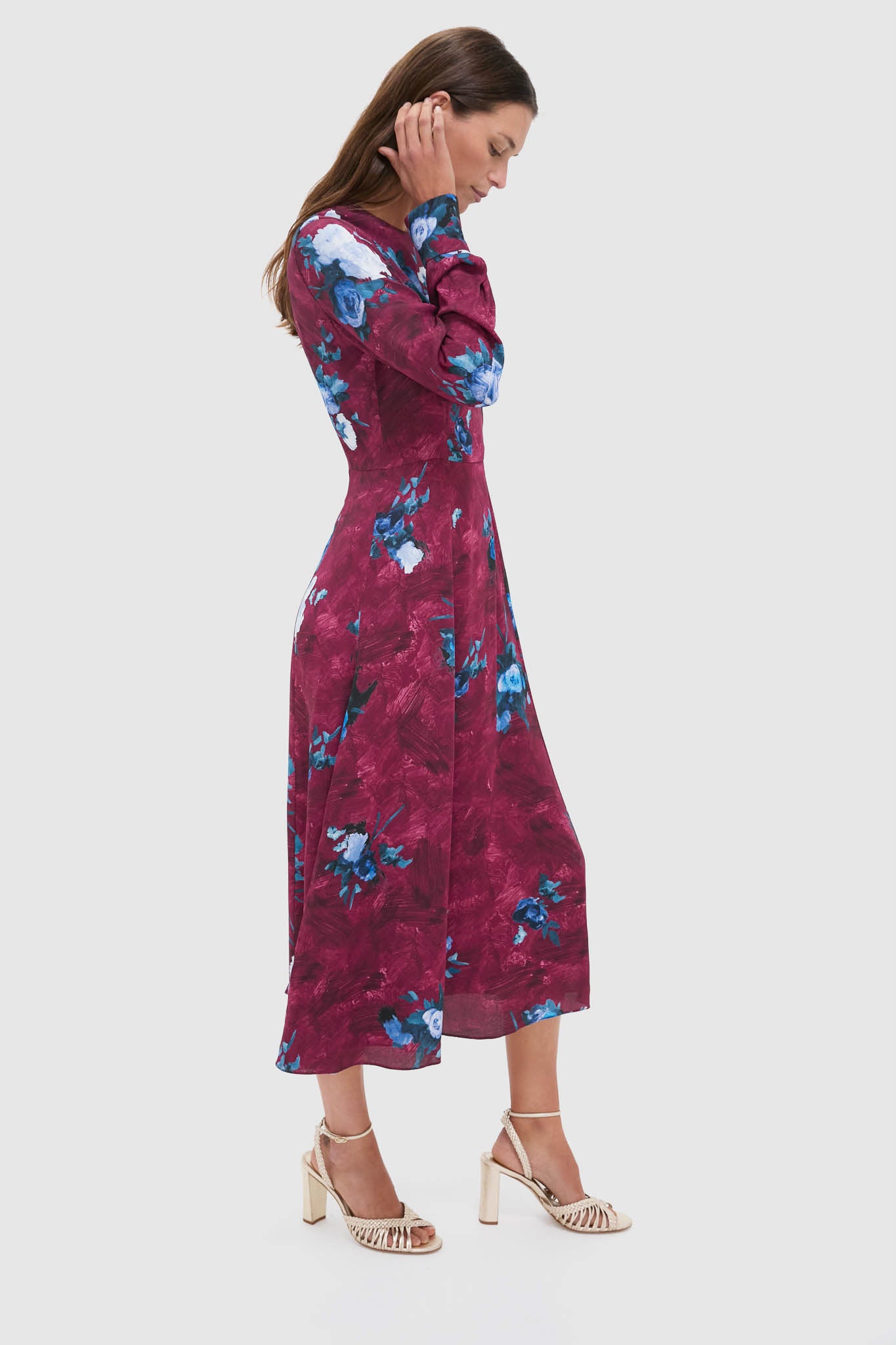 Abstract Rose Milberry Red Long Sleeve Midi Dress on a model, showcasing classic elegance with painterly floral motifs for an effortless, high-end look. Perfect for fun, sophisticated events.