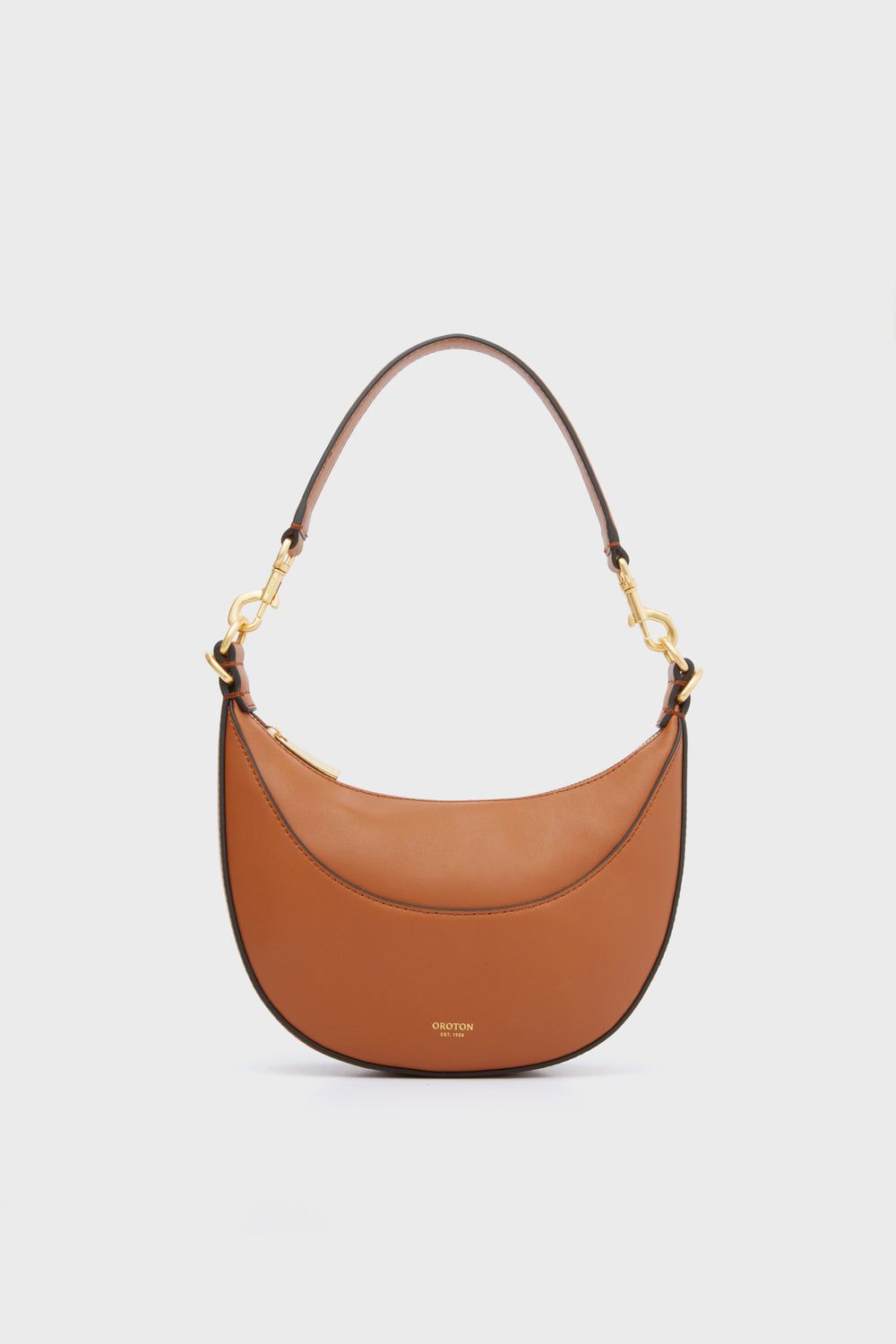 A brown Oroton shoulder bag with gold hardware and a curved silhouette, reflecting luxury Australian accessory style.