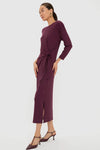 Model in Winetasting Side Tie Elspeth Maxi Dress, featuring a classic faux wrap tie, effortless jersey fabric, subtle slit, and fun removable shoulder pads for a high-end look.
