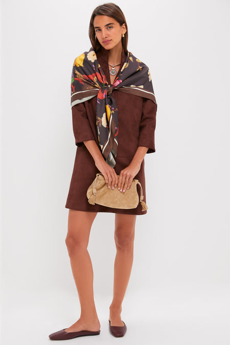 Woman models the classic Ganache Vegan Suede Clifton Dress, featuring three-quarter sleeves and V-neckline, paired with elegant accessories for an effortless, high-end look.