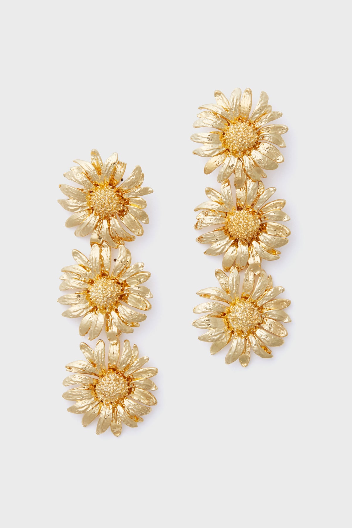 Gold Sunflower Drop Earrings by Petit Moments feature three daisy-shaped flowers stacked vertically—perfect feminine accessories from a female-owned brand.