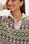 Smiling woman in a classic, high-end Eggshell Fair Isle Edna Sweater with a relaxed fit and spread collar, exuding an effortless and fun style.