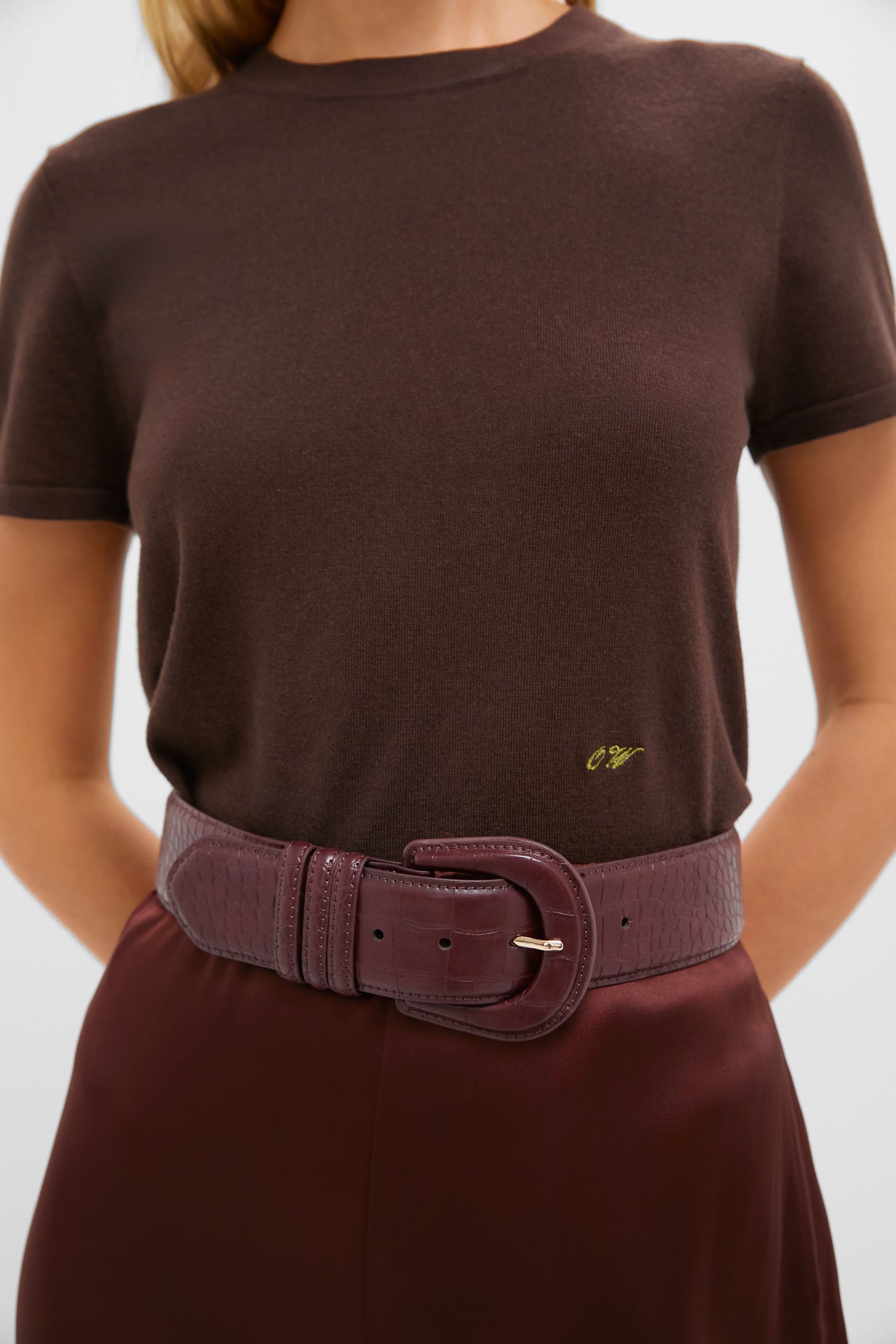 Oxblood Croc-Embossed Waist Belt adds a classic, high-end touch to the outfit, cinching the waist effortlessly with its fun, sophisticated design.