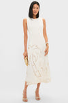 Woman in a classic white dress showcases the Mermaid Garden Vine Bracelet, 7 - MOP, an effortless, high-end piece with mother of pearl and gold detailing.