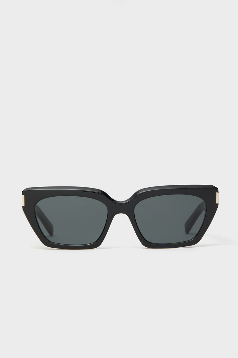 Saint Laurent black cat-eye sunglasses featuring dark lenses and gold corner accents, inspired by Yves Saint Laurent.