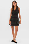 Model wearing classic, high-end Pathway Hoop Earrings in Gold with rectangular links, paired with an effortless plaid dress, black flats, and a structured handbag. Fun and sophisticated.