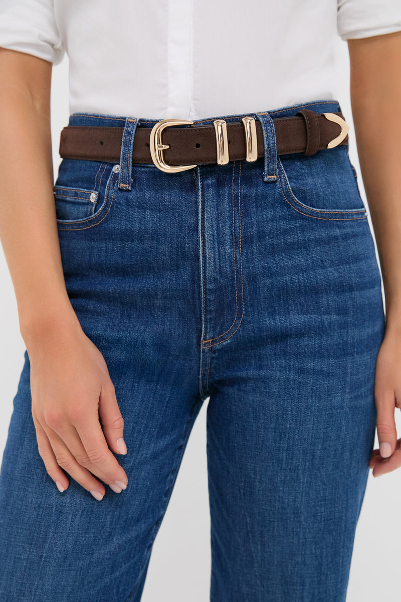 Chocolate Suede Western Belt with gold-tone buckle, effortlessly cinching high-rise jeans for a classic, high-end look. Paired with a white top, conveying fun sophistication.