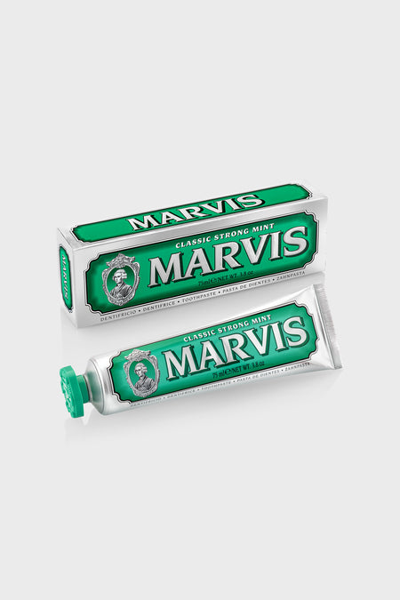 Marvis Classic Strong Mint toothpaste and box, showcasing a high-end, classic design. Offers effortless, fun oral care with long-lasting freshness and minty aroma.