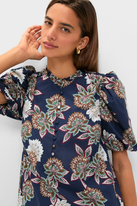 Navy Floral Mimi Mini Dress with classic puff sleeves and ruffle collar, epitomizing effortless, fun style with a high-end floral print and button details.