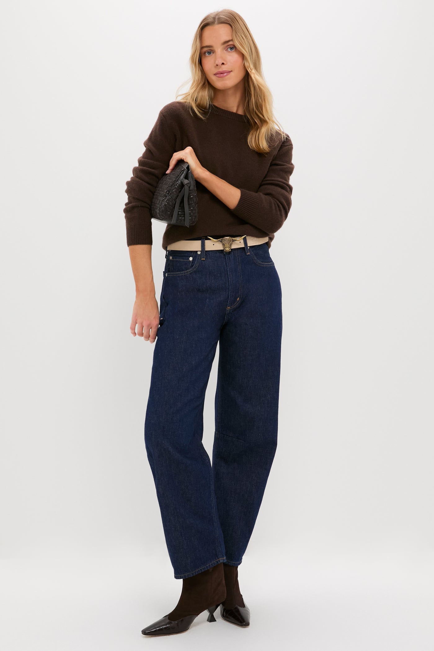 Model wearing a classic, high-end outfit featuring the Espresso and Chantilly Suede Belt, showcasing effortless style with wide-leg jeans and pointed-toe ankle boots.