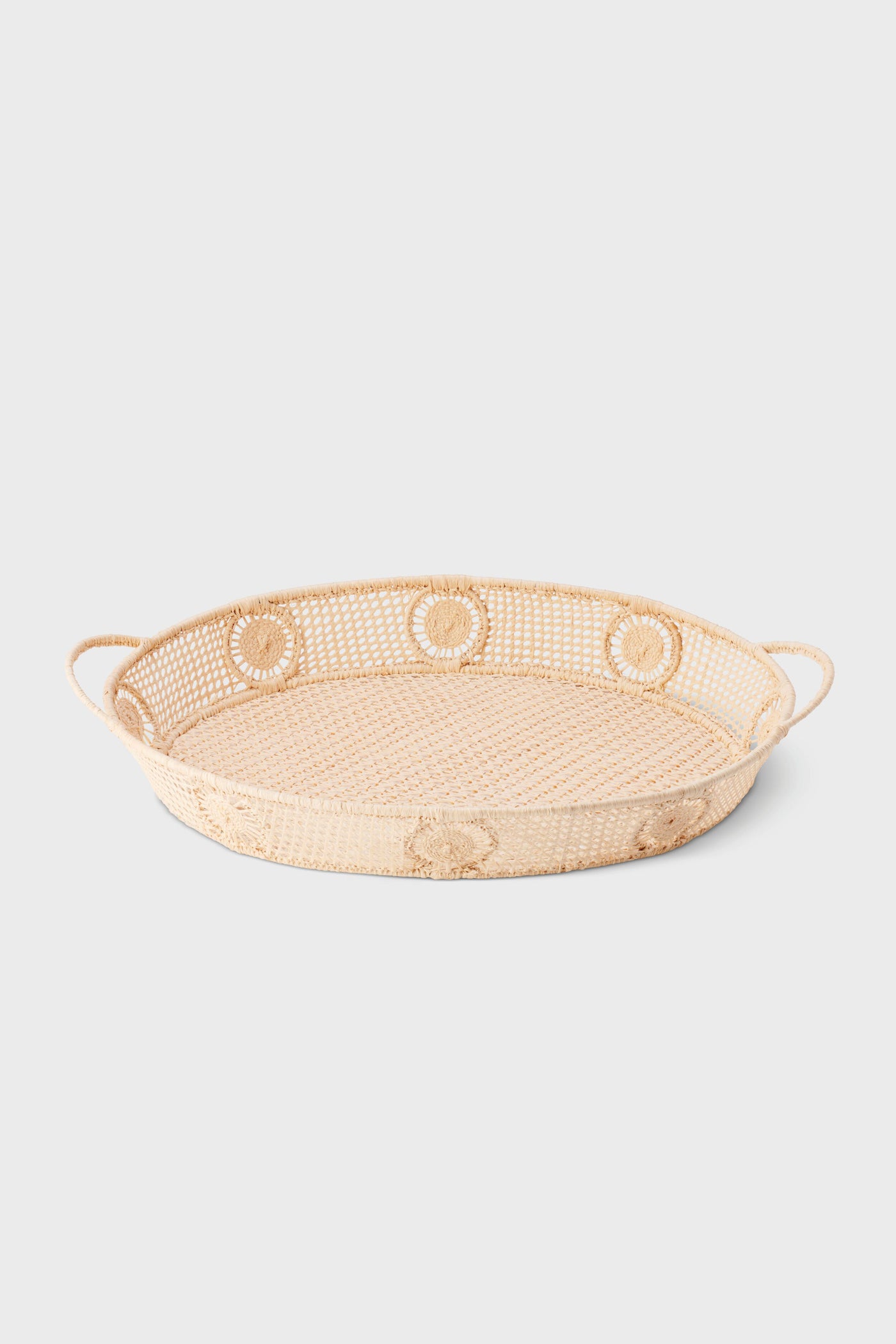 Raffia Round Tray: A classic, effortless woven tray with loop handles, perfect for high-end, fun entertaining or stylish tabletop decor, embodying a coastal, organic charm.