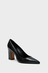Schutz black leather pumps with a pointed toe and thick block heel, stylishly showcased.
