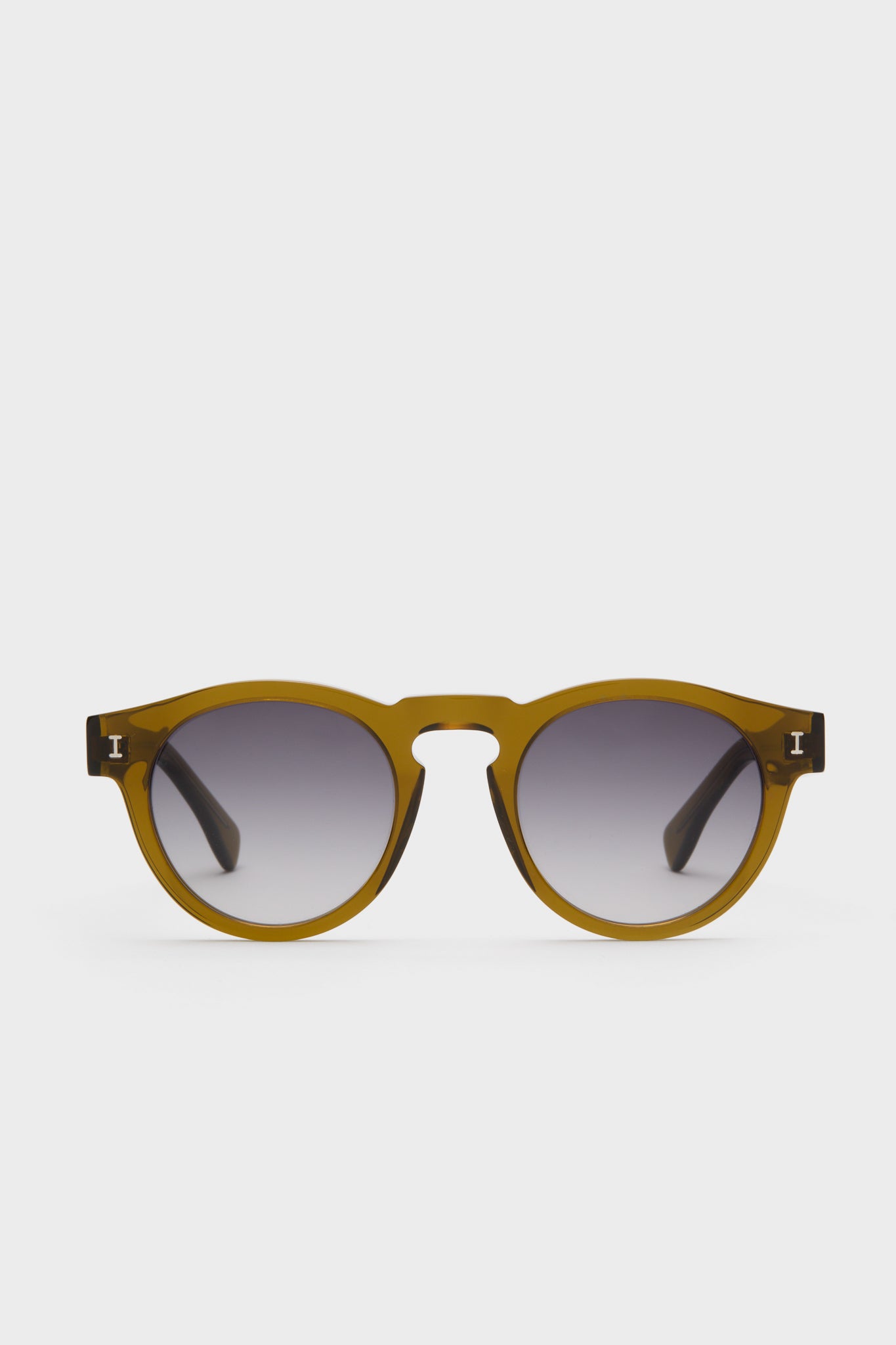 Round, olive green Illesteva Moss Leonard sunglasses with dark gradient lenses, handmade in Italy and displayed against a plain white background.