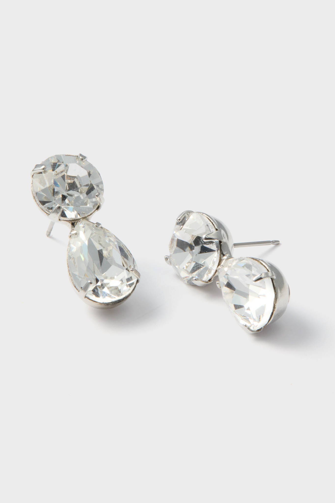 Crystal Pamina Earrings feature classic, effortless elegance with round and teardrop-shaped faceted stones in silver-tone metal, perfect for high-end, fun evenings.