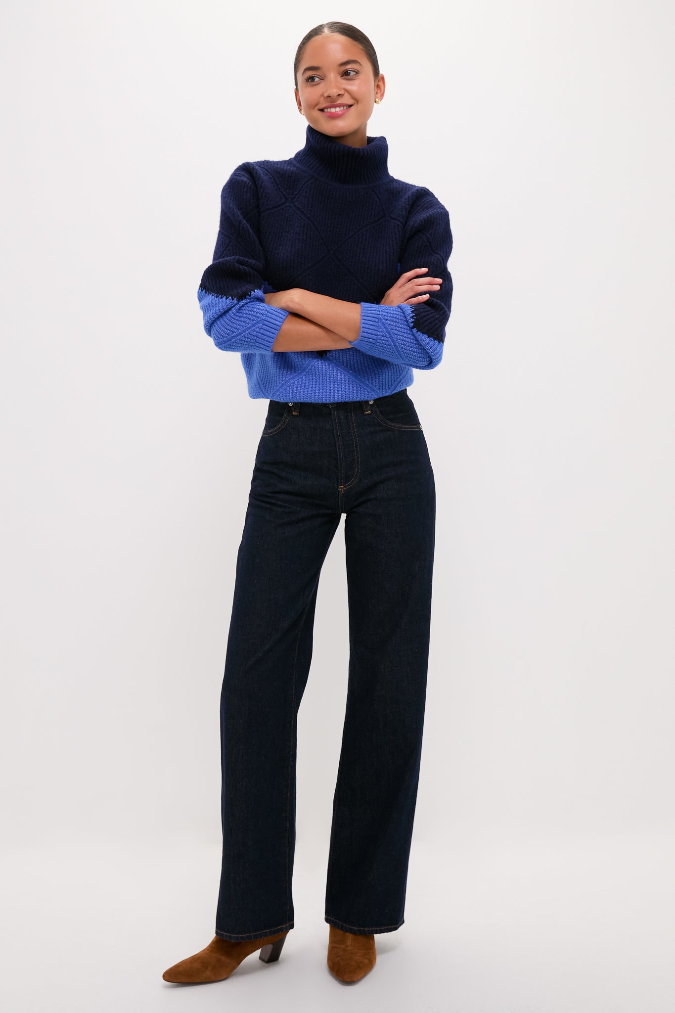 Person wearing the Navy & Cerulean Diamond Demi Turtleneck with dark high-waisted jeans and brown ankle boots, exuding an effortless, classic, and high-end style.