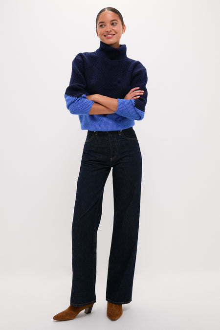 Person wearing the Navy & Cerulean Diamond Demi Turtleneck with dark high-waisted jeans and brown ankle boots, exuding an effortless, classic, and high-end style.