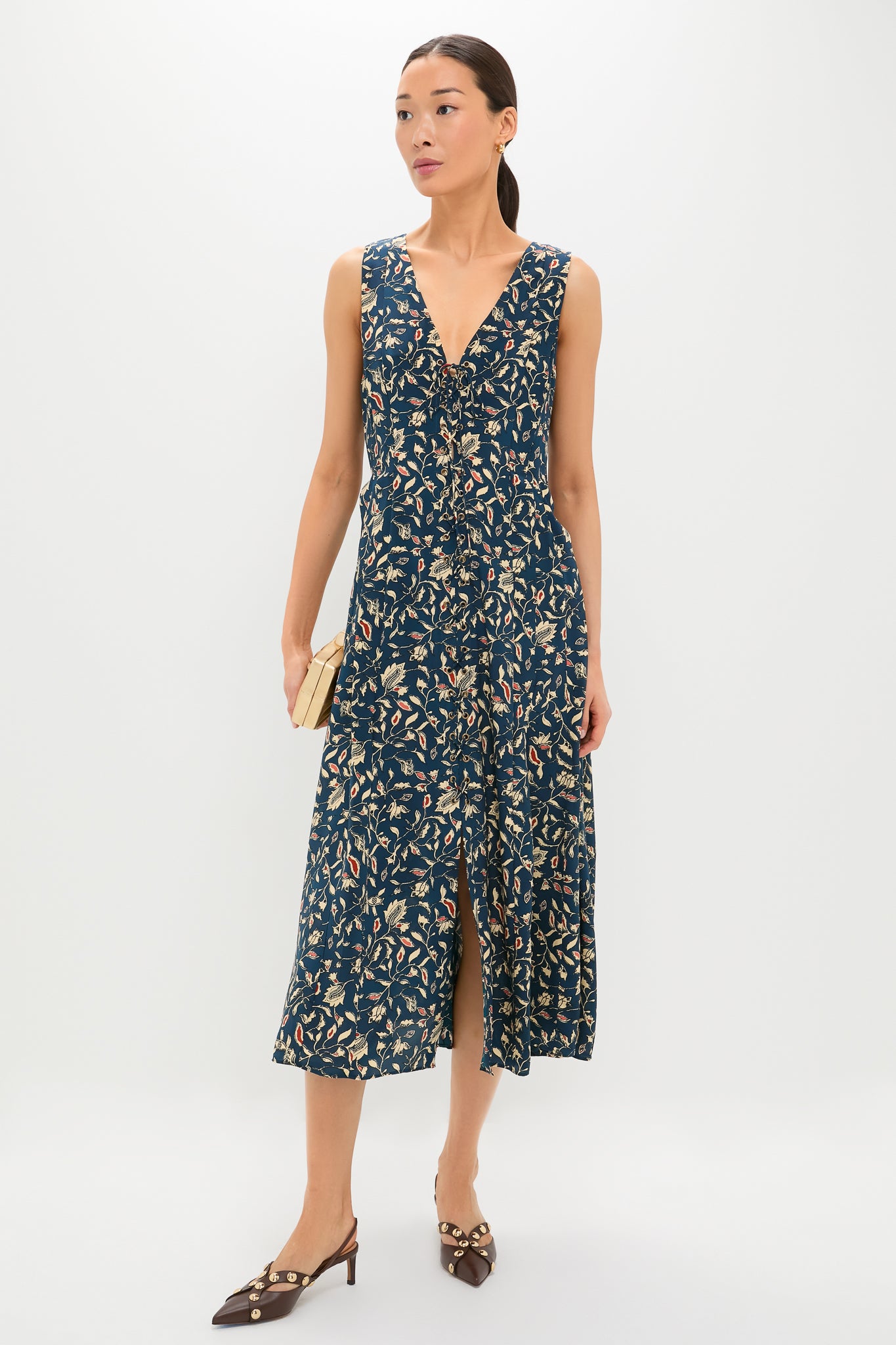 Model showcasing the classic Dark Brown Vendome Studded Kitten Heels, exuding effortless elegance with gold studs and slingback style—perfect for fun, high-end fashion moments.