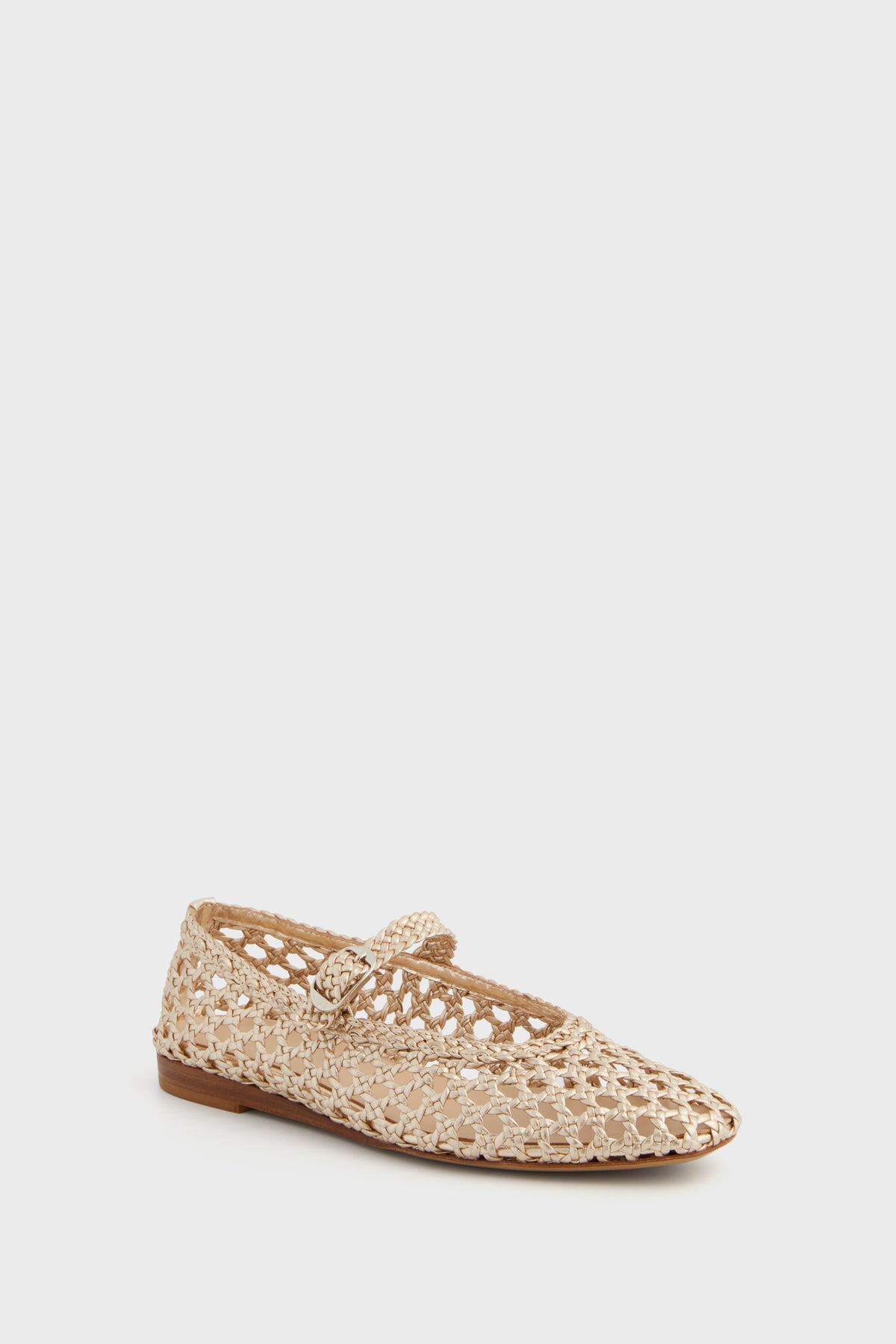 A beige woven flat shoe with a pointed toe, Mary Jane strap, and low heel by Le Monde Beryl, inspired by handcrafted Italian elegance.