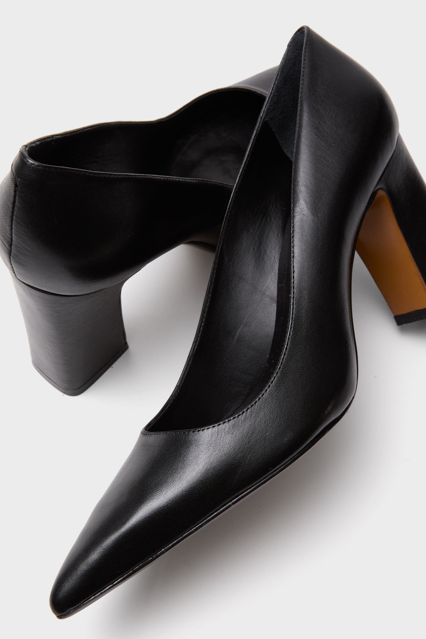 Black Eleanor Heels, classic women's black leather pumps with pointed toes and high block heels, offering an effortless, fun, and high-end style for confident fashion choices.