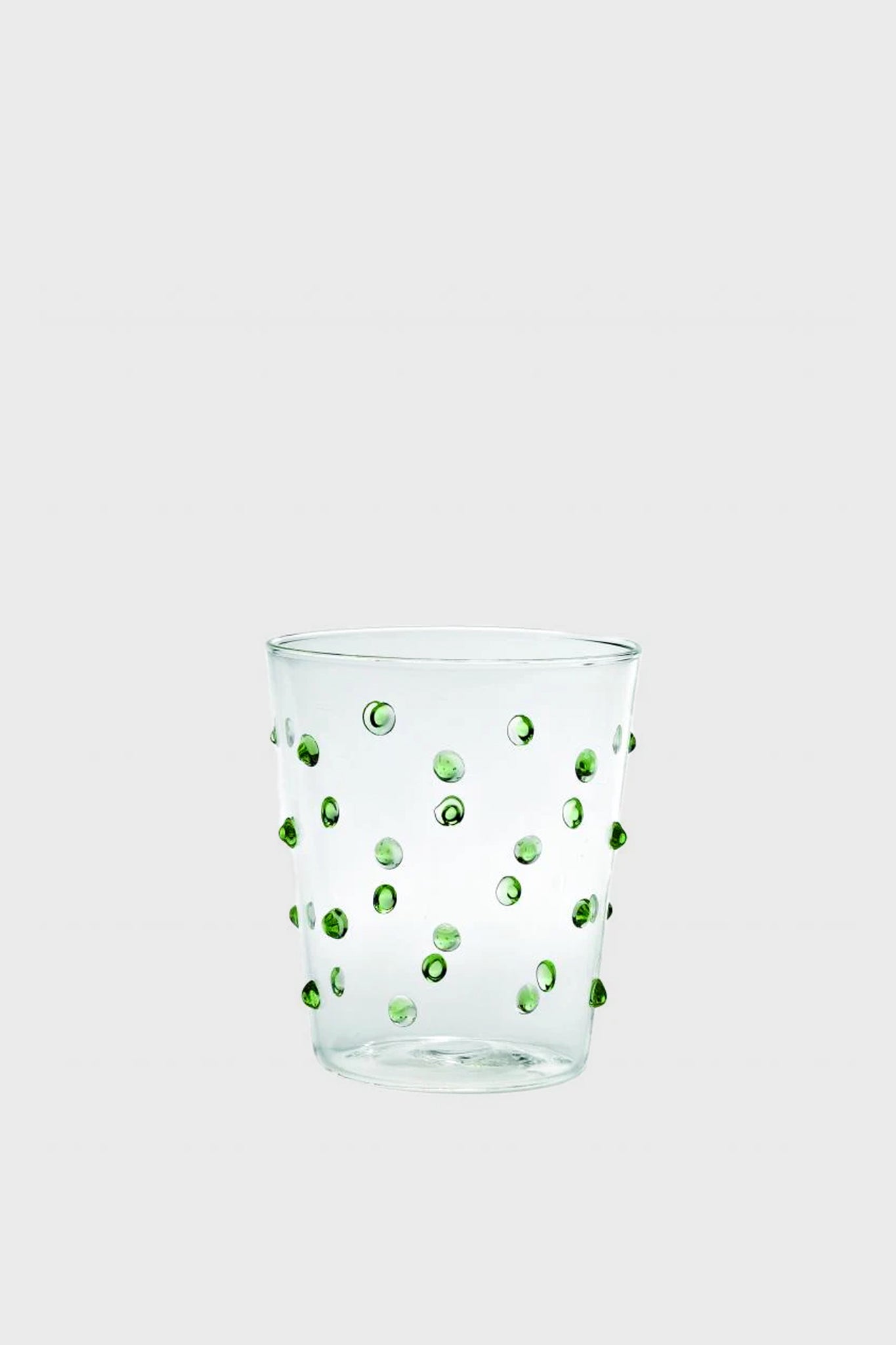 Green Dots Party Tumbler (Set of 6) features classic and effortless hand-blown glassware with raised green dots, combining fun and high-end elegance for any occasion.