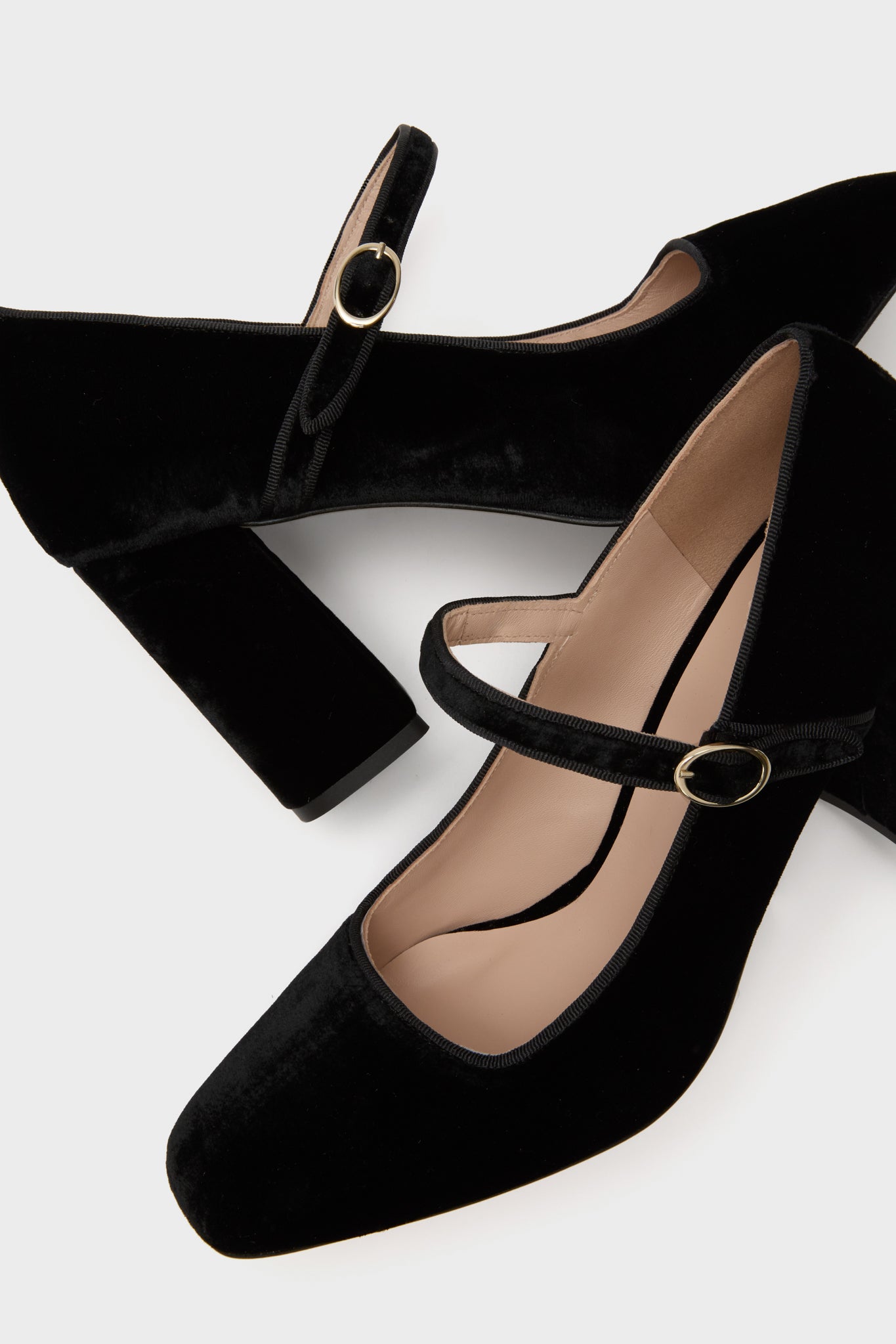 Black Velvet Julia Heels, classic women's Mary-Jane pumps with block heels and gold buckle strap, crafted in Spain for an effortless, high-end look. Perfect for fun, versatile styling.