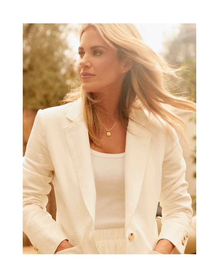 Shea McGee in a white blazer with a tank and matching shorts