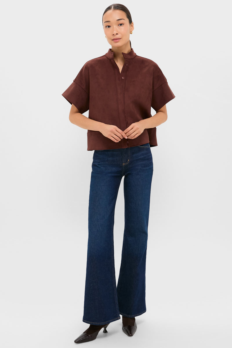 Model wearing the classic Ganache Vegan Suede Trapunto Stitch Sofia Shirt, showcasing an effortless, boxy silhouette with trapunto stitch details, paired with high-end flared jeans.