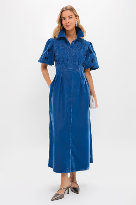 Model showcases the Gunmetal Leather Mimi Heels, featuring a pointed toe and diagonal arch strap, paired with a classic deep-blue dress for an effortless, high-end look.