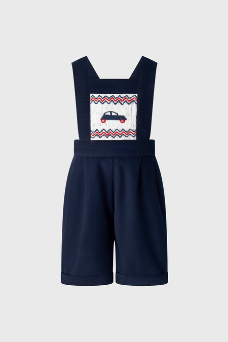 Classic Car Smocked Dungarees featuring an effortless, fun embroidered car design on a smocked panel, adjustable straps, and rolled cuffs, embodying high-end children's fashion.