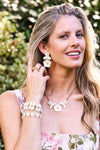 Young woman wearing classic Mermaid Garden Vine Bracelet, 7 - MOP, featuring elegant mother of pearl leaves and golden details, exuding an effortless, high-end bohemian charm.