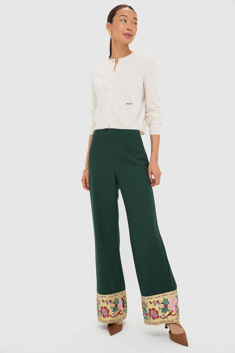 Model wears Garden Scrollwork Jacquard Cuff Erin Pants, showcasing classic, high-end style with effortless floral jacquard hem details, paired with a cropped cardigan and heels.