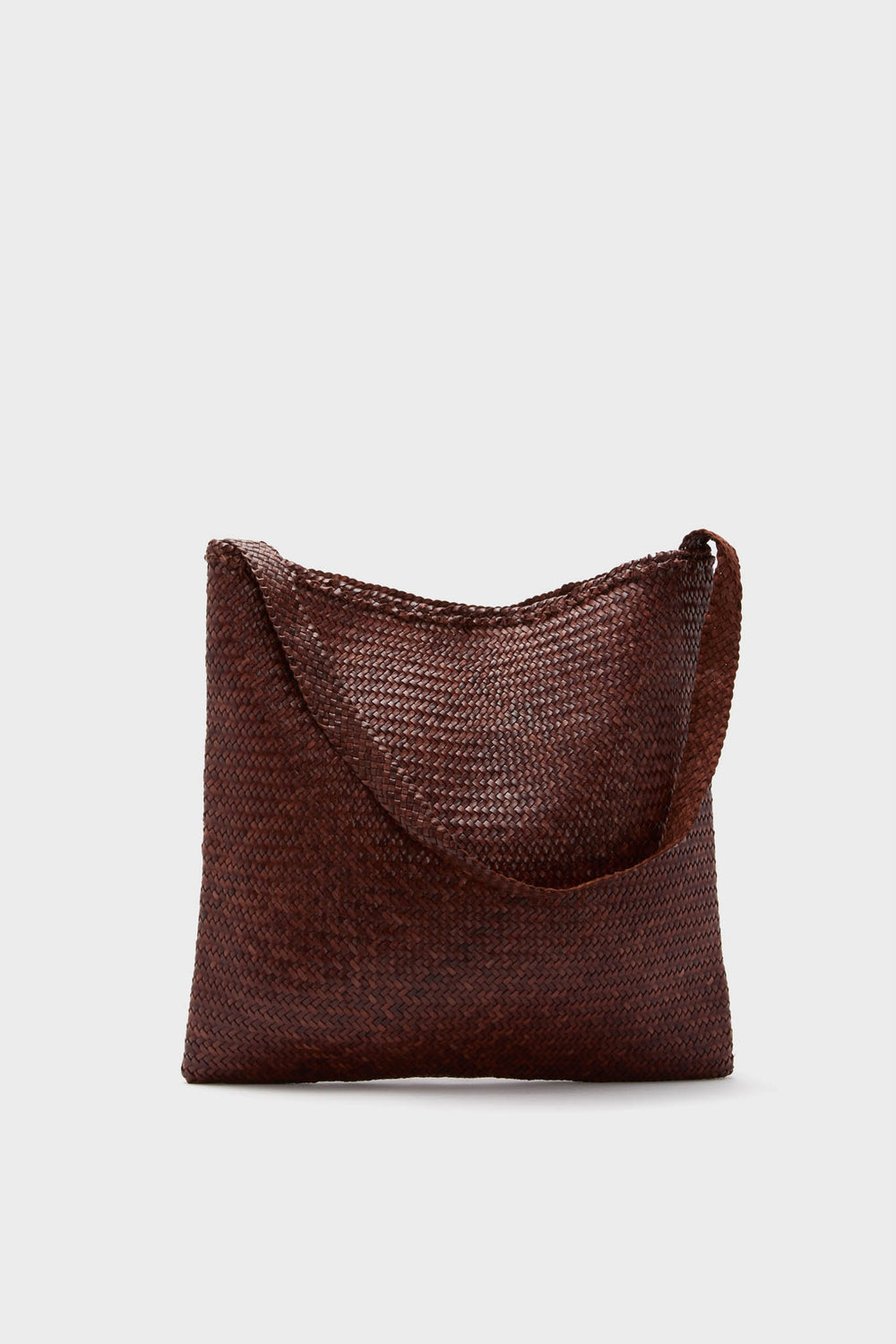 A brown hand-crafted woven leather tote from Dragon Diffusion, featuring a single strap and made of premium buffalo calf leather.