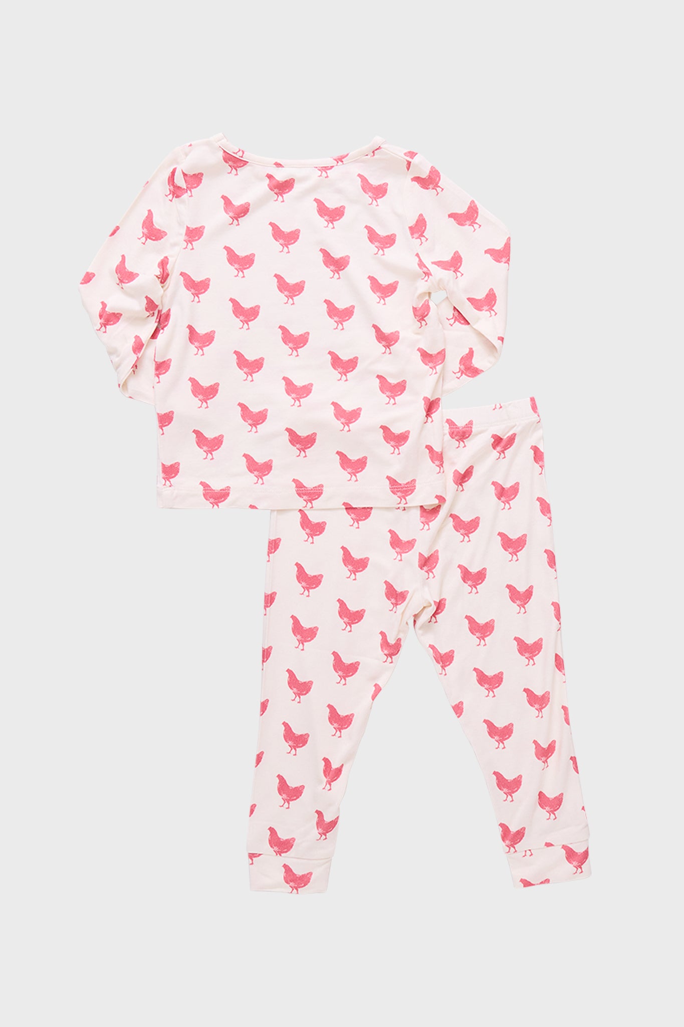 Pink Chickens Kids Bamboo Pj Set: A classic, fun two-piece pajama set with a pink hen motif. Effortlessly combines high-end comfort and style for a cozy bedtime experience.
