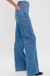 French Kiss Taylor High Rise Wide Leg jeans exude effortless style with their classic wide-leg silhouette in premium Italian denim, embodying a fun, high-end look.