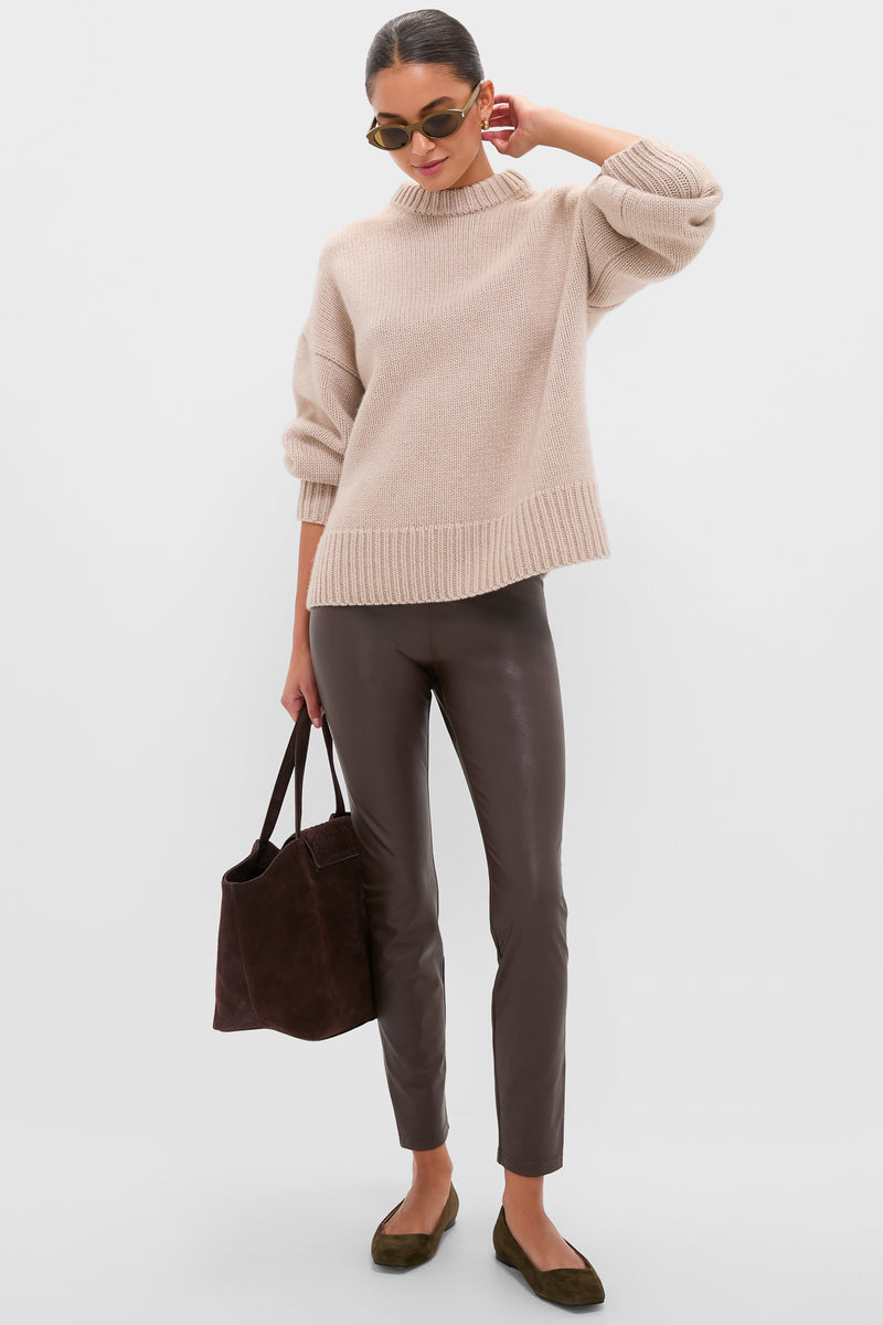 Woman models classic, dark olive suede Nadia flats with square toes, embodying effortless style. Perfect for fall, these high-end shoes add a sophisticated touch to any outfit.