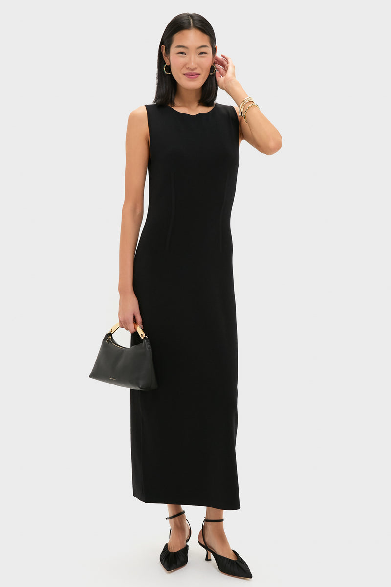 Woman wearing Berry Gem Medium Hoop Earrings - Malachite, featuring classic malachite stones and gold berries, paired with a sleek black dress and gold accessories, exuding effortless, high-end style.