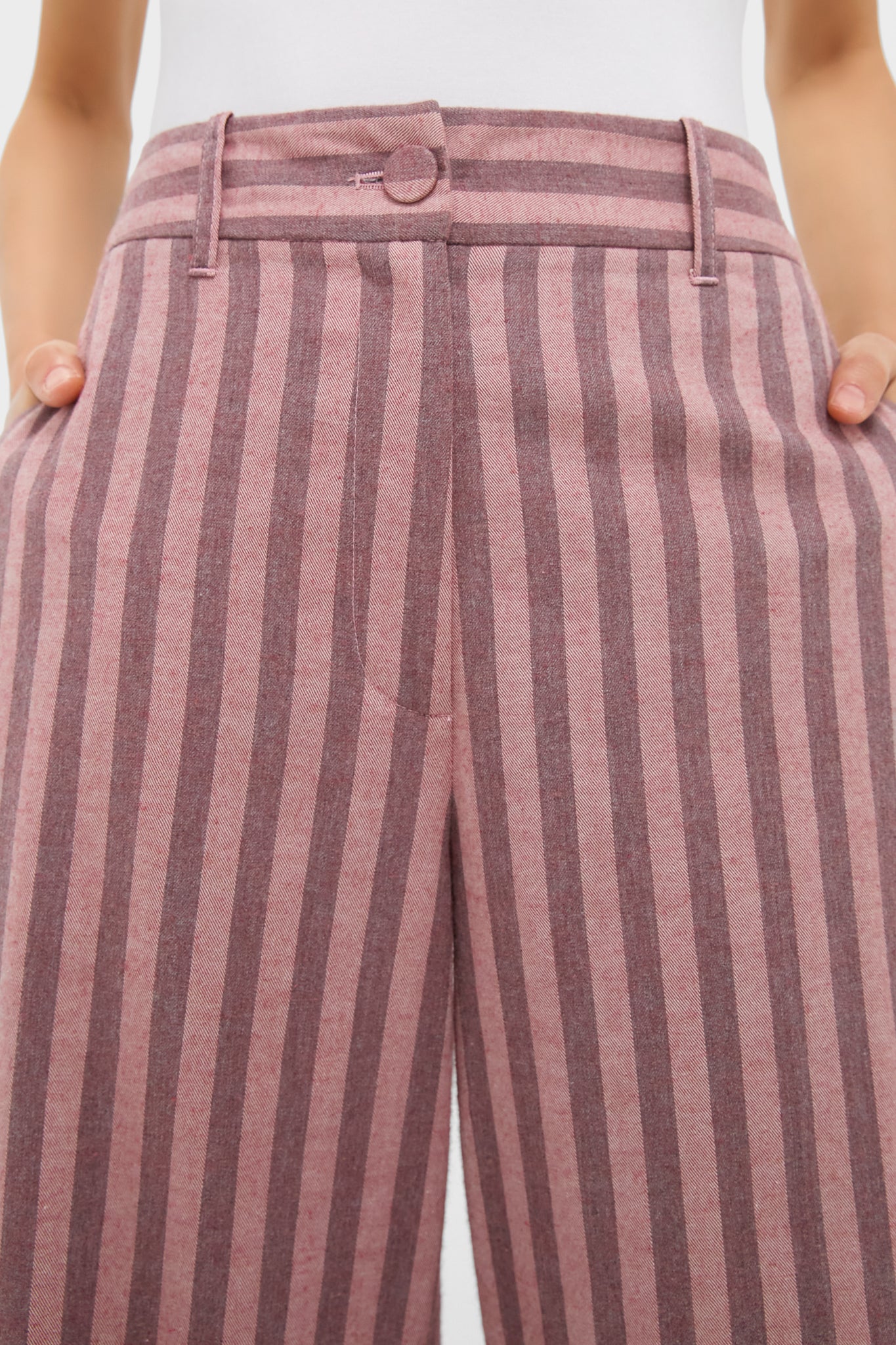 High-waisted Mauve Stripe Wyatt Pants with classic wide-leg silhouette and vertical stripes, offering an effortless, fun style with belt loops and front pockets.