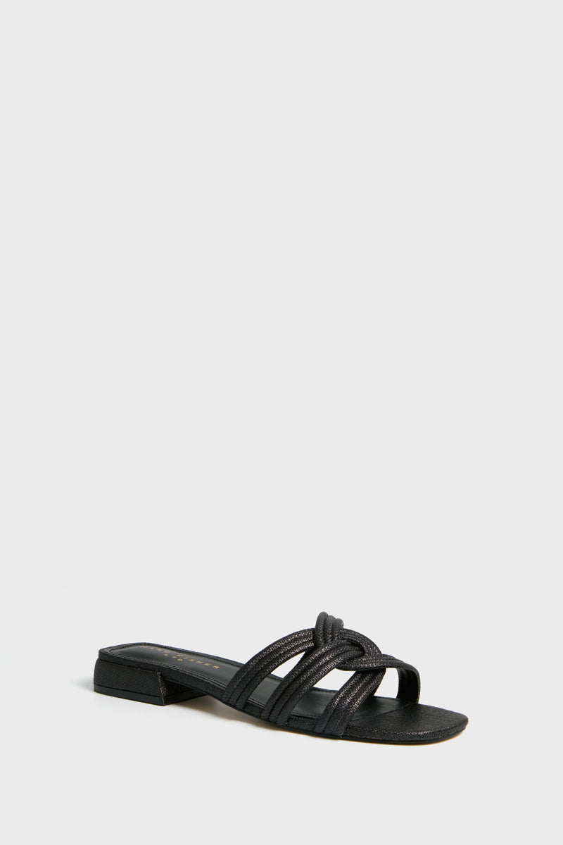 The Marc Fisher Casara Sandal is a black flat slide with a low block heel and three woven upper straps across the foot.