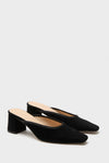 Black Suede Tilda Mules: Classic slip-on heels with an effortless mule silhouette, featuring an elongated square toe and fun, comfortable block heel, exuding high-end European craftsmanship.