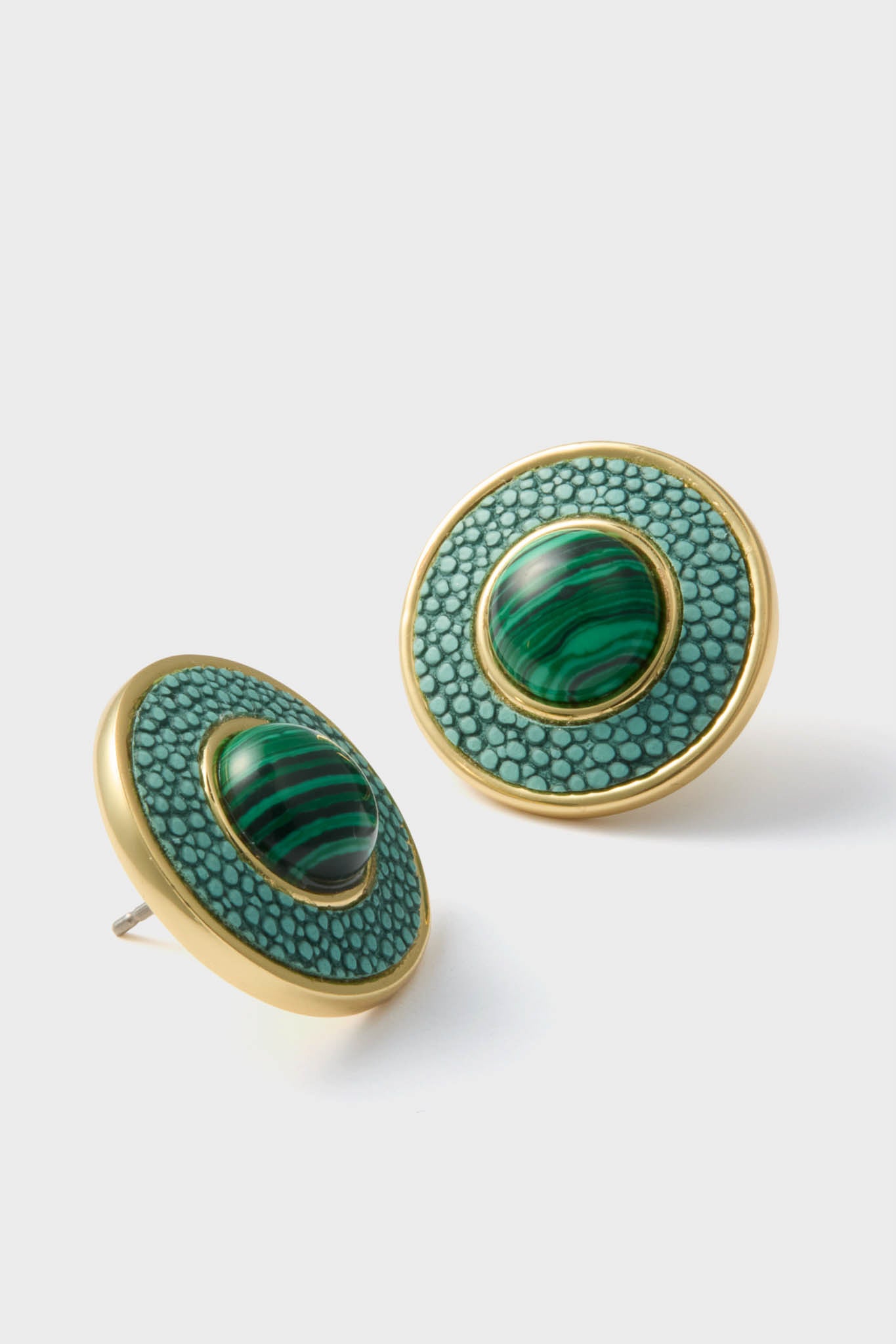 Malachite Emery Studs feature classic round design with textured teal inlay and malachite-style cabochon, offering an effortless, fun, high-end look for any occasion.