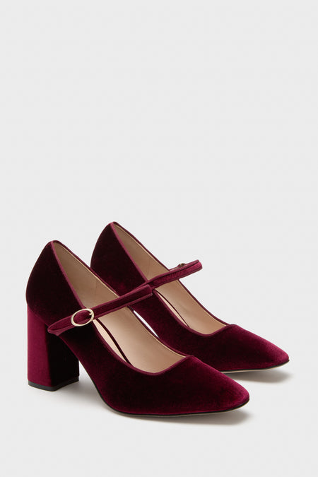 Oxblood Velvet Julia Heels: Classic Mary-Jane pumps, effortless in deep velvet with a rounded toe, adjustable strap, and fun block heel. High-end style for versatile wear.