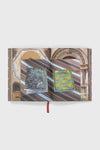 Cabana Anthology: The Anniversary Edition, a classic hardcover coffee-table book, showcases effortlessly high-end design with vibrant, decorative Cabana magazines displayed on its open pages.