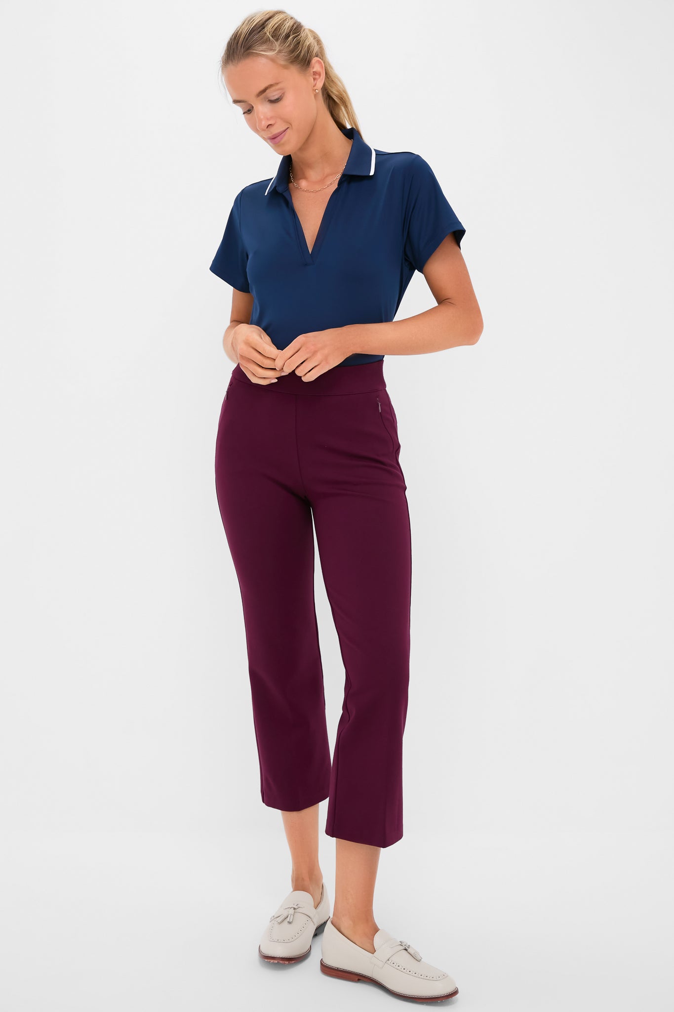 Model showcases Petite Winetasting Compression September Pant, featuring a classic, high-end cropped design with side zip pockets and a slightly flared silhouette, embodying effortless and fun style.