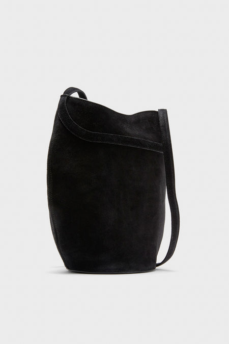 Black Suede Belted Bucket Bag with adjustable strap, magnetic snap closure, and gold-tone hardware, offering an effortless, high-end, and classic style for versatile wear.