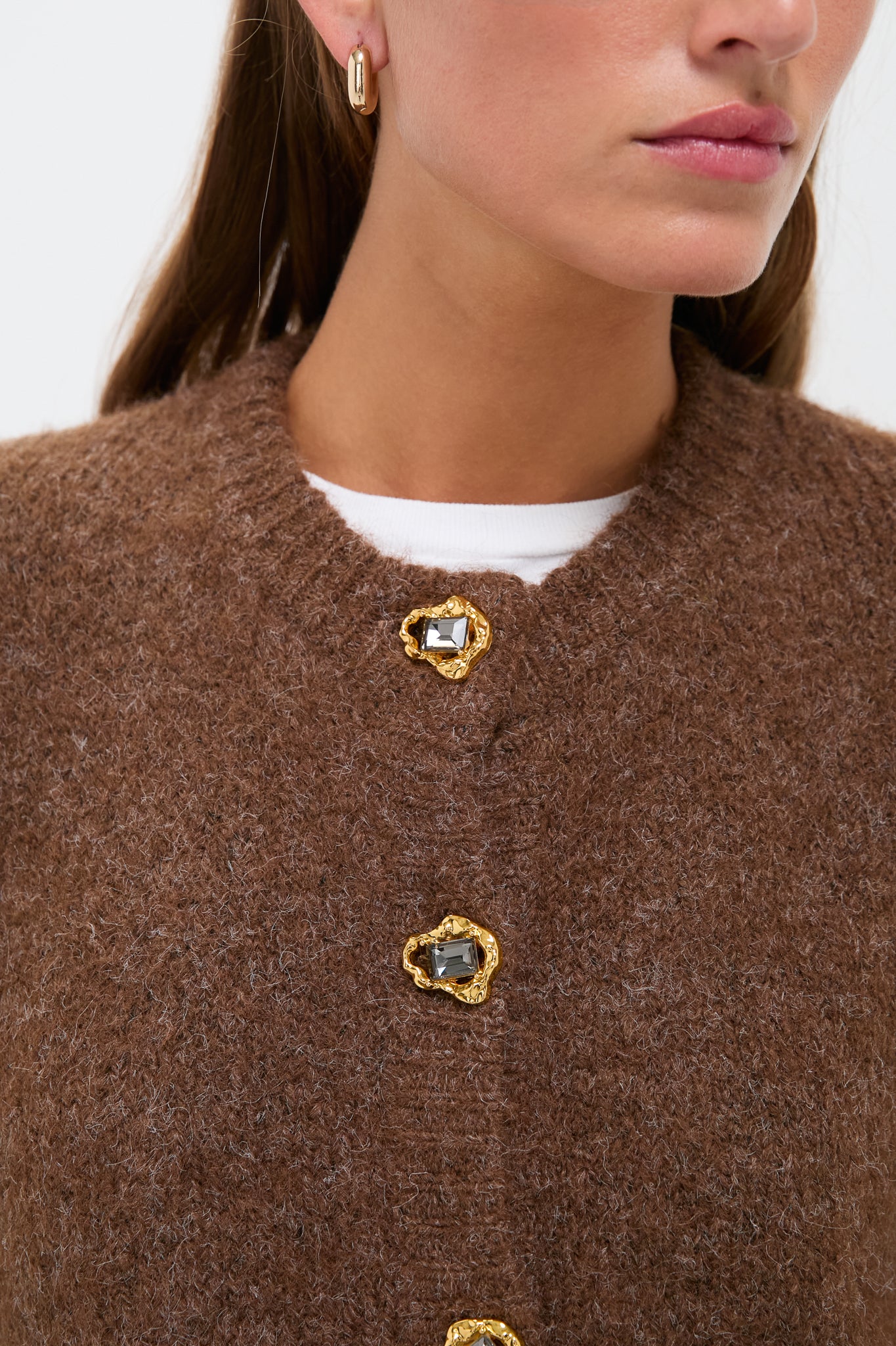 Close-up of a woman in the Brown Morgan Cardigan, showcasing its classic and effortless style with high-end gold-tone buttons, perfect for a fun, polished look.