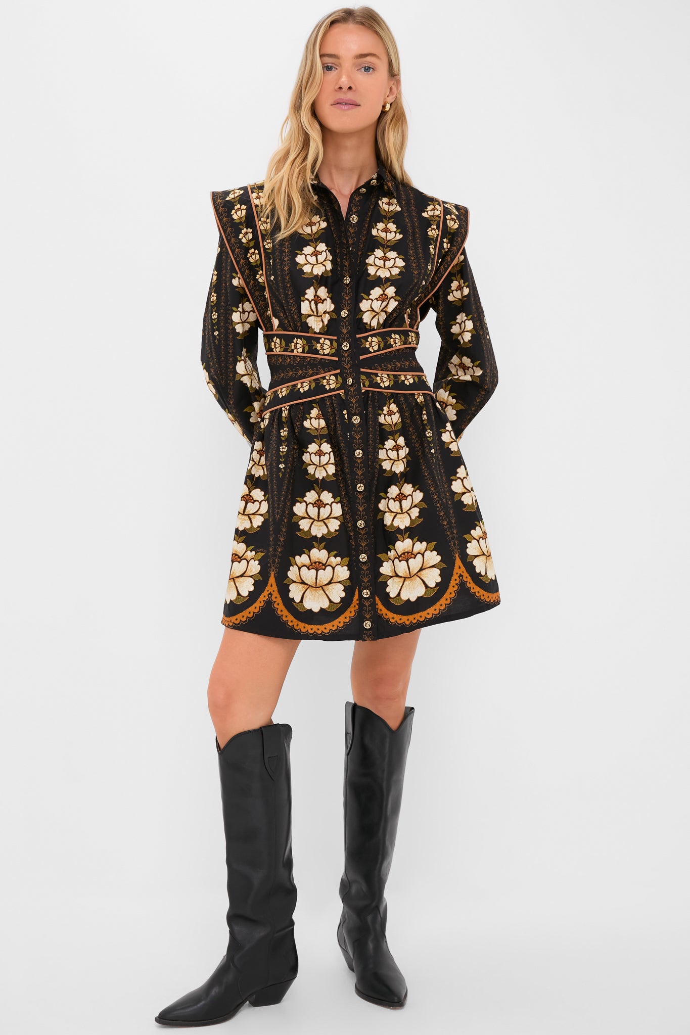 Woman models the Black Embroidered Flowers Topstitching Long Sleeve Mini Dress with bold floral print, structured shoulders, and tall black boots, exuding a classic, effortless, and high-end style.