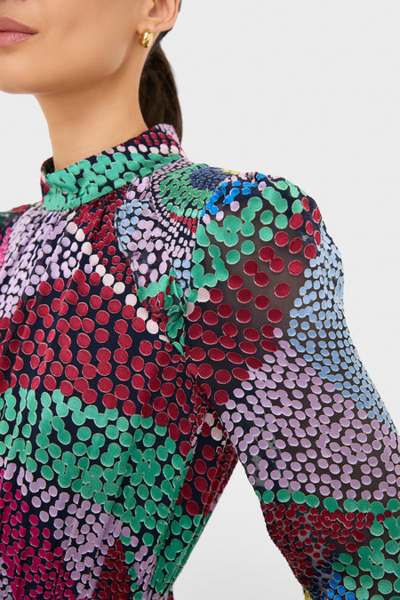 Jangle Jacqui-B Dress: A classic, high-end semi-sheer blouse with dot print, mock neck, and puffed sleeves. Effortlessly fun and modern, perfect for confident styling.