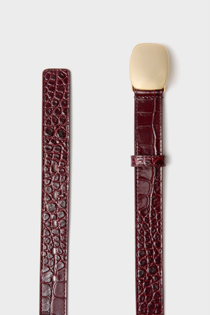 Merlot Jacob Croco Belt with gold-tone buckle and croc-embossed leather, combining classic elegance and effortless sophistication for a high-end, fun style statement.