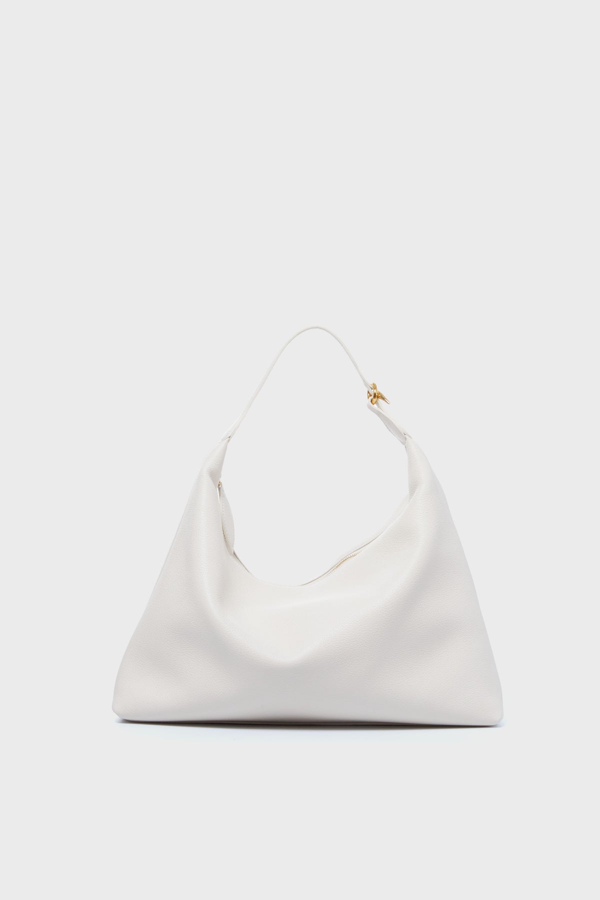 The Liffner minimalist white calf leather shoulder bag features a soft, slouchy shape, single top handle, and small gold-tone hardware accent, all showcasing Italian craftsmanship.